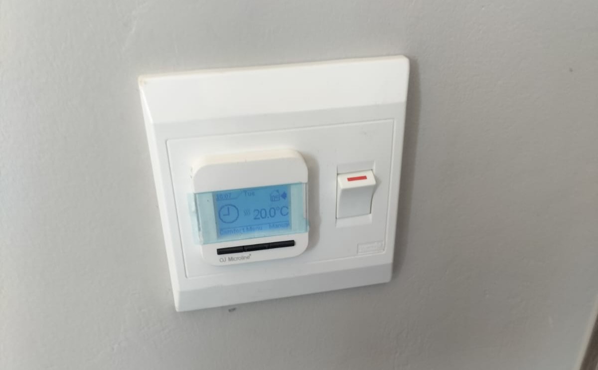 OJ Microline wi-fi smart thermostat controlling a hydronic underfloor heating zone in a South African home