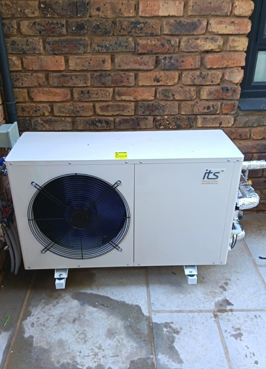 ITS heat-pump water heater installed against a brick wall in South Africa