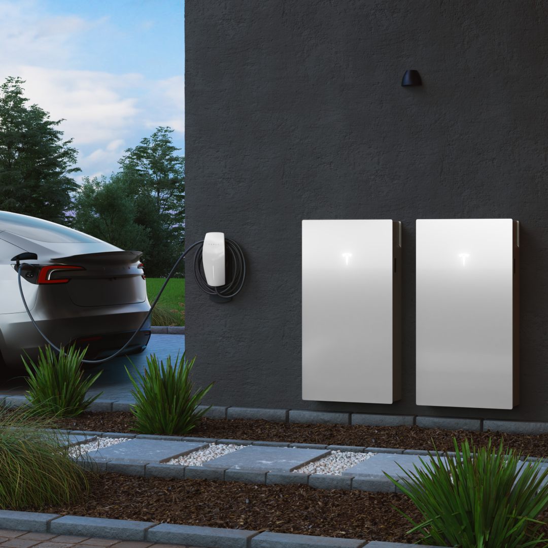 Tesla EV charging via Tesla Wall Connector alongside two Tesla Powerwall 3 units, solar-powered EV charging integration